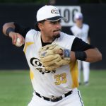 Third baseman, Isac Mandujano, readies his throw to first base.
