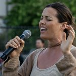 Singer, Delfina Geus, performs the National Anthem.