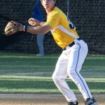 Third baseman, Sam Marr, readies his throw to first base.