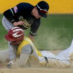 Colt 45s base runner slides into a bag while the fielder on the opposing team applies the tag.