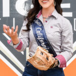 Jackie Scarry, Miss Rodeo California, tossing a baseball.