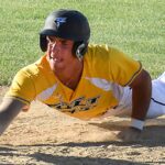 Baseman Isaiah Cortez sliding head-first into a bag.