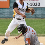 Jonathan Kumai throws to first base after getting the force at second base.