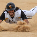 One of the Tweedt twins slides into a base.