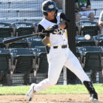 Right-handed batter Ariv Camacho begins his swing on an inside pitch.