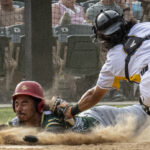 Catcher Mackenzie Higuchi tags a base runner slides into home plate (versus Fresno Athletics, Sunday, June 11th, 2023).