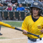 Batgirl, Kennedy, retrieving a Colt 45s bat from home plate (versus Novato Knicks, Sunday, June 15th, 2023).