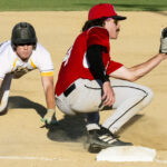 Giacomo Crosetti dives head first into third base as the Knick's third-baseman, Lucas Schafer, awaits the throw (versus Novato Knicks, Sunday, July 23rd, 2023).