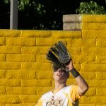 Centerfielder, Trajan Rogowski, tracks down a fly ball (photograph by Bill Wagner).