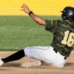 Colt 45s player and baserunner, Preston Conklin (16), slides into second base.