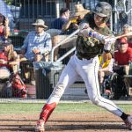 Left-handed Colt 45s player swinging at the pitch.