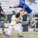 Colt 45s player and catcher, Tyler Jones (9), tagging an opposing baserunner in middair to get the out.