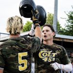 Colt 45s baserunners Timmy Ayers (5) and Andrew Mora (25) tapping helmets at home plate in celebration of Mora's home run (photographed by Bill Wagner on 2026-07-11).