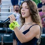 Guest singer performing the National Anthem during the pregame ceremony (photographed by Bill Wagner on 2026-07-24).