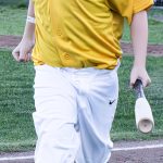Colt 45s batboy trotting back to the dugout from home plate with a bat in his left hand (photographed by Bill Wagner on 2026-07-25).